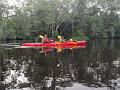 Paddling our Excursion down the Lukenie. JJ is taking a breack in the pirogue